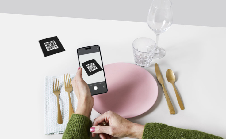 person scanning QR code with their phone